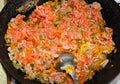 Half-cooked minced meat is fried in a pan with carrots Royalty Free Stock Photo