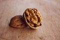 Half Cracked Walnut on the wooden table Royalty Free Stock Photo
