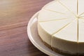 Half cream cake on wood table Royalty Free Stock Photo