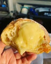 half croissant, croissant stuffed with cream, dessert , egg custard in croissant, pastry with lots of filling