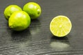 Half cut lime fruit on the table. Royalty Free Stock Photo