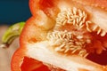 Half cut pepper on wooden table, close up Royalty Free Stock Photo