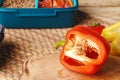 Half cut pepper on wooden table, close up Royalty Free Stock Photo