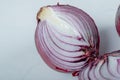 Half cut purple onion on white background