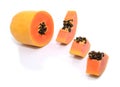 Half cut and whole papaya fruits Royalty Free Stock Photo