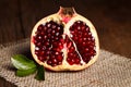 Half-cutted pomegranate on canvas