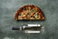 Half a delicious homemade italian pizza on the table, pizza with wine, copy space for your text, Royalty Free Stock Photo