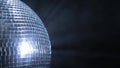 Half disco mirror ball is rotated