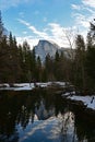 Half Dome reflected in Merced River in Yosemite National Park, California. Royalty Free Stock Photo