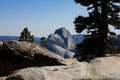 Half Dome Yosemite California Against Blue Sky With Pine Trees Royalty Free Stock Photo