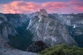 Half Dome and Yosemite Valley in Yosemite National Park during colorful sunset with trees and rocks. California, USA Royalty Free Stock Photo