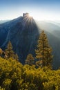 Half Dome and Yosemite Valley in Yosemite National Park during colorful sunrise with trees and rocks. California, USA Sunny day Royalty Free Stock Photo