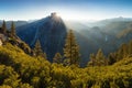 Half Dome and Yosemite Valley in Yosemite National Park during colorful sunrise with trees and rocks. California, USA Sunny day Royalty Free Stock Photo