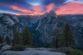 Half Dome and Yosemite Valley in Yosemite National Park during colorful sunrise with trees and rocks. California, USA Sunny day Royalty Free Stock Photo