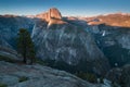 Half Dome and Yosemite Valley in Yosemite National Park during colorful sunset with trees and rocks. California, USA Royalty Free Stock Photo
