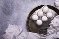 Half a dozen white eggs in the metal cake pan. still life