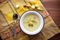 half-eaten bowl of potato leek soup showing spoon and napkin Royalty Free Stock Photo