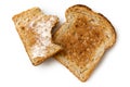 Half eaten buttered slice of whole wheat toast and whole dry slice of toast isolated on white from above. Royalty Free Stock Photo