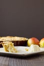 Half eaten slice of apple pie a la mode, vertical Royalty Free Stock Photo