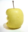 A half eaten yellow apple with white background