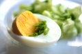 Half an egg with green onions, chopped egg, vegetable salad. Macro yellow yolk, white egg white, chopped onion. Useful breakfast,