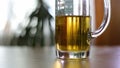 Half empty beer mug on table