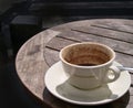 Half-empty cup on a cafe table