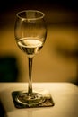 Half empty glass of white wine Royalty Free Stock Photo