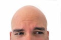 Half face of bald man in white background. Royalty Free Stock Photo