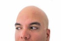 Half face of bald man in white background. Royalty Free Stock Photo