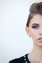 Half face beautiful girl with make-up with blue eyes and smile, Royalty Free Stock Photo