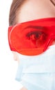 Half face of dentist woman wearing mask and protective glasses Royalty Free Stock Photo