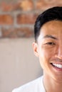 Half face portrait close up of happy asian casual businessman smiling, copy space Royalty Free Stock Photo