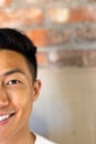 Half face portrait close up of happy asian casual businessman smiling, copy space Royalty Free Stock Photo