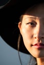 Half face portrait of a young oriental woman Royalty Free Stock Photo