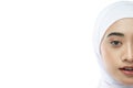 half face potrait of beautiful hijab woman wearing white veil with smiling