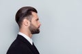 Half-faced close up portrait of serious confident strict concentrated handsome attractive thinking pensive minded with stylish tr Royalty Free Stock Photo