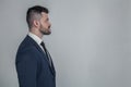 Half-faced profile side view close up portrait of serious focused handsome attractive style stylish modern masculine guy with Royalty Free Stock Photo