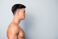 Half-faced profile side view portrait of confident shaven w