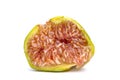 half fig, macro shot on white background shows the juicy red fruit pulp with the seeds Royalty Free Stock Photo