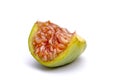 half fig, macro shot  on white background shows the juicy red fruit pulp with the seeds Royalty Free Stock Photo