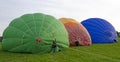 Half-filled hotair-balloons lying side-by-side