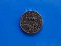 Half franc coin, France over blue Royalty Free Stock Photo