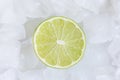 Half fresh lime in the Ice cubes. Royalty Free Stock Photo