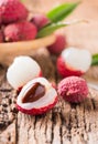 Half fresh organic lychee fruit on wood Royalty Free Stock Photo
