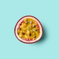 Half of fresh passion fruit on mint background