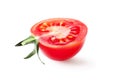 Half of fresh, red tomato with green leaves isolated on white background. Clipping path Royalty Free Stock Photo