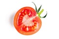 Half of fresh, red tomato with green leaves isolated on white background. Clipping path Royalty Free Stock Photo