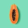 Half of fresh ripe papaya fruit on green background Royalty Free Stock Photo