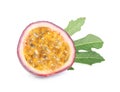 Half of fresh ripe passion fruit maracuya with green leaf isolated